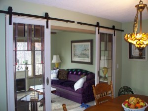 Antique doors with sliding hardware, pendant light with ceiling medallion